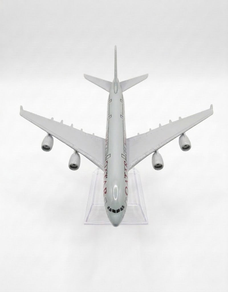 Front top-down view of a 15cm Qatar Airways Airbus A380 diecast metal airplane model resting on a clear acrylic stand in Lebanon.