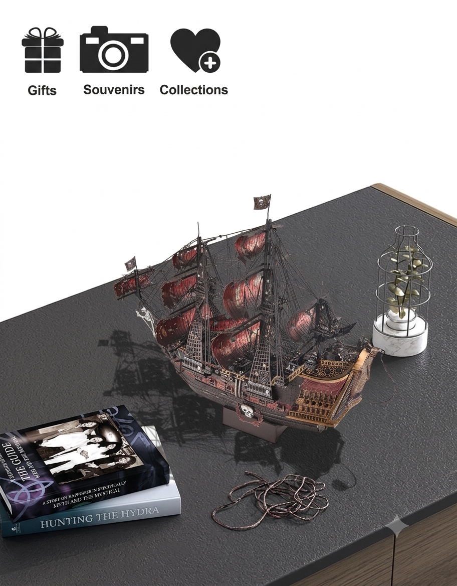Assembled Queen Anne's Revenge 3D metal ship displayed as a desk ornament beside books and decor.
