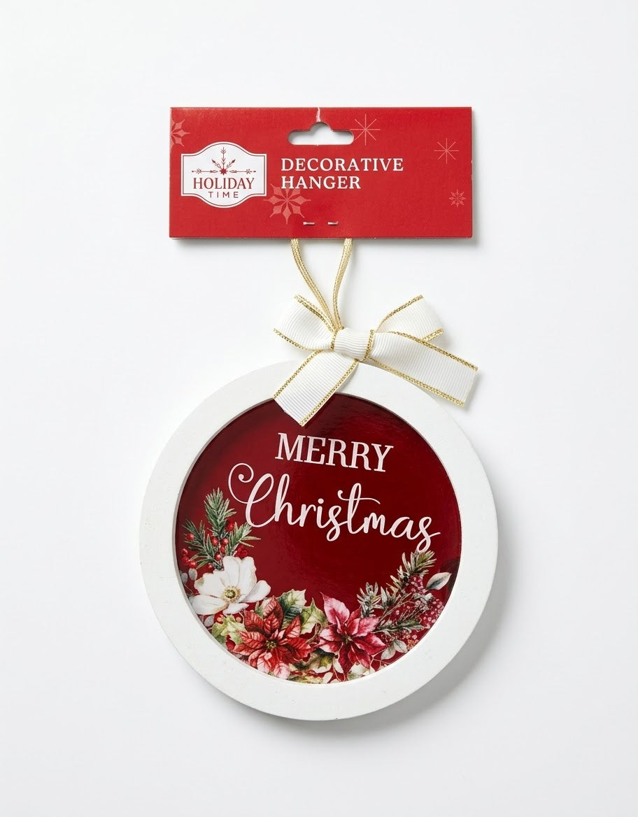 Holiday Time round Merry Christmas decorative hanger featuring a white wooden frame, deep red backdrop with floral poinsettia wreath, and a gold-trimmed white ribbon bow.