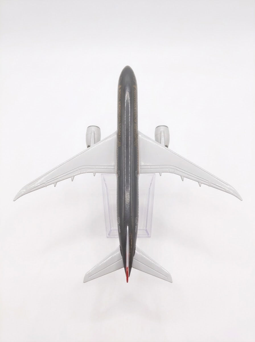 Top-down dorsal view of Royal Jordanian Boeing 787 metal diecast model plane showcasing wing details and dark livery – scale model hobby shop Lebanon.