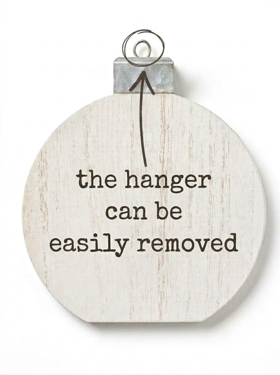 Rustic whitewashed round wooden ornament plaque featuring a removable galvanized metal hanger cap for tabletop display or wall hanging