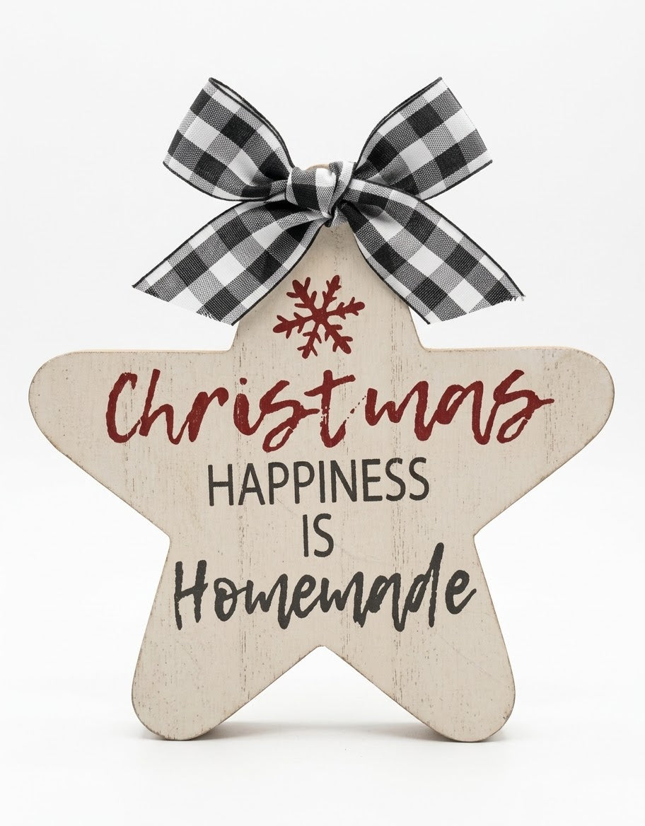 Front view of a rustic wooden star Christmas tabletop plaque with a black and white buffalo plaid bow, printed with "Christmas Happiness Is Homemade" and a red snowflake design.