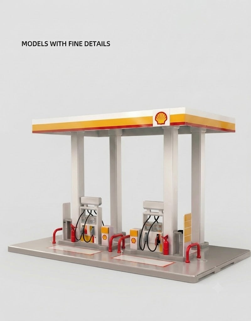 Assembled 1:64 scale Shell gas station diorama model featuring detailed canopy, dual fuel pumps, and safety barriers.