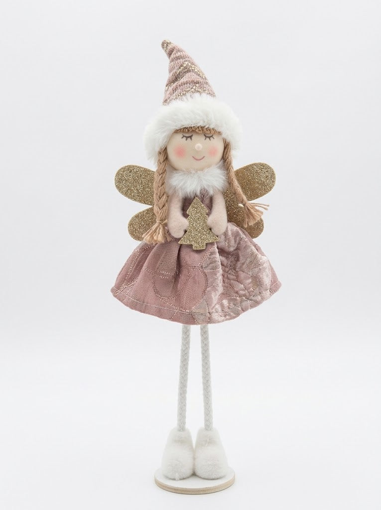 Freestanding plush Christmas fairy doll wearing a blush pink embroidered dress and fur-trimmed hat holding a glitter holiday tree.