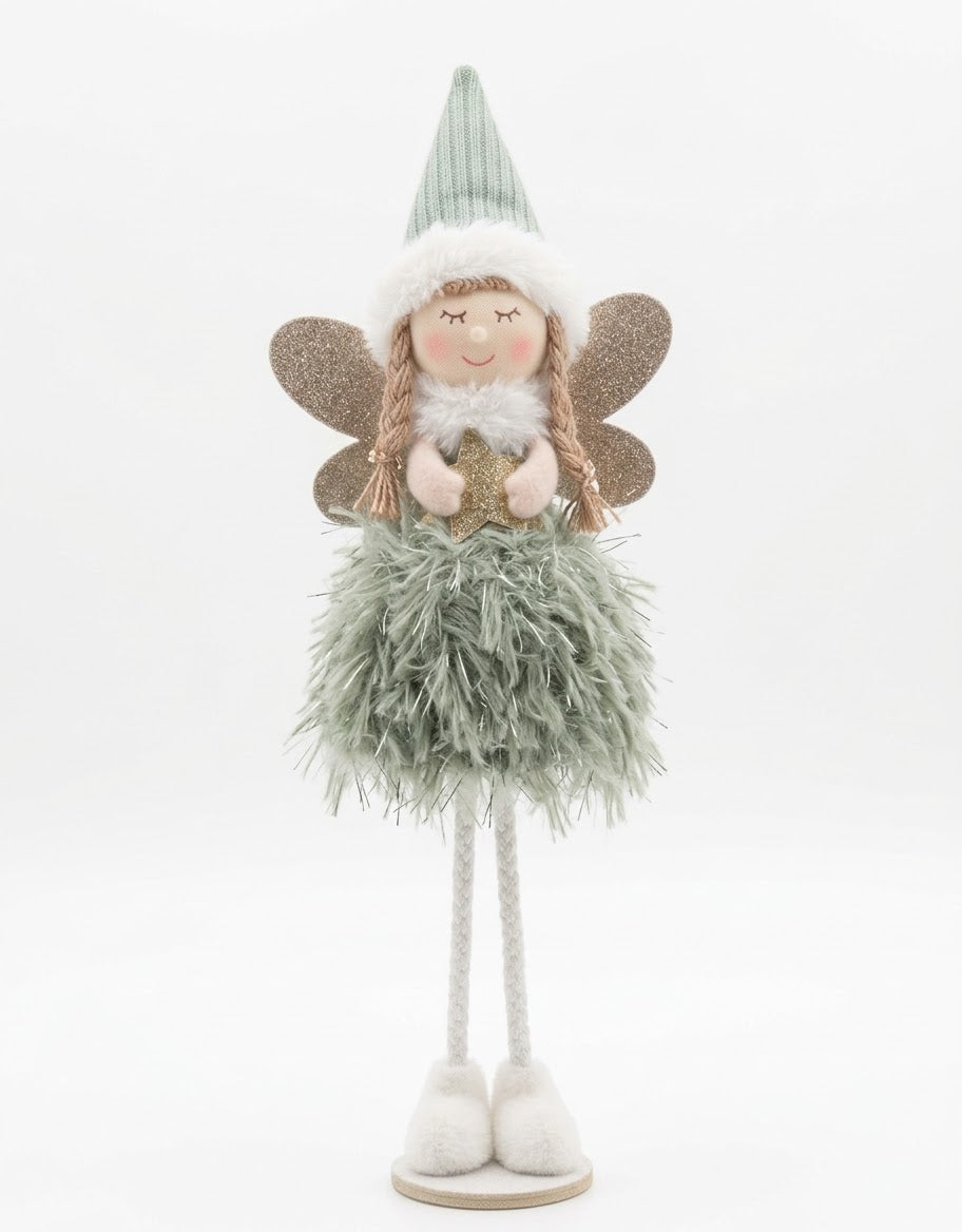 Standing plush winter angel doll in a sage green feathered dress and ribbed knit hat holding a golden Christmas star.