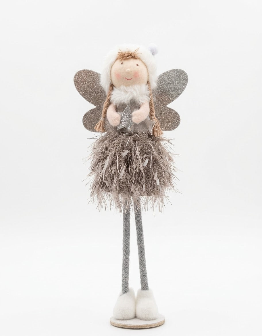 Freestanding plush Christmas angel doll with a shimmery silver tinsel skirt, fuzzy beret, and glitter wings holding a metallic star.