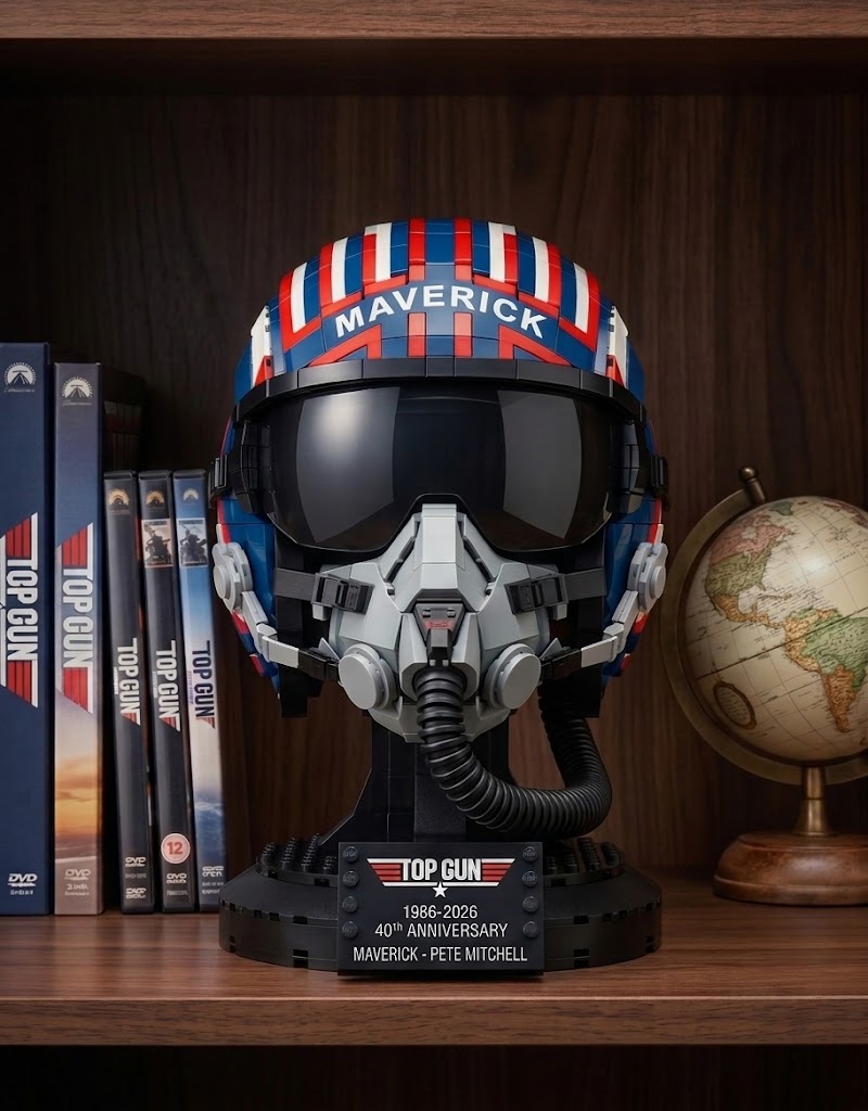 Top Gun Maverick collector helmet on a wooden bookshelf next to Top Gun movie DVDs and a vintage globe.