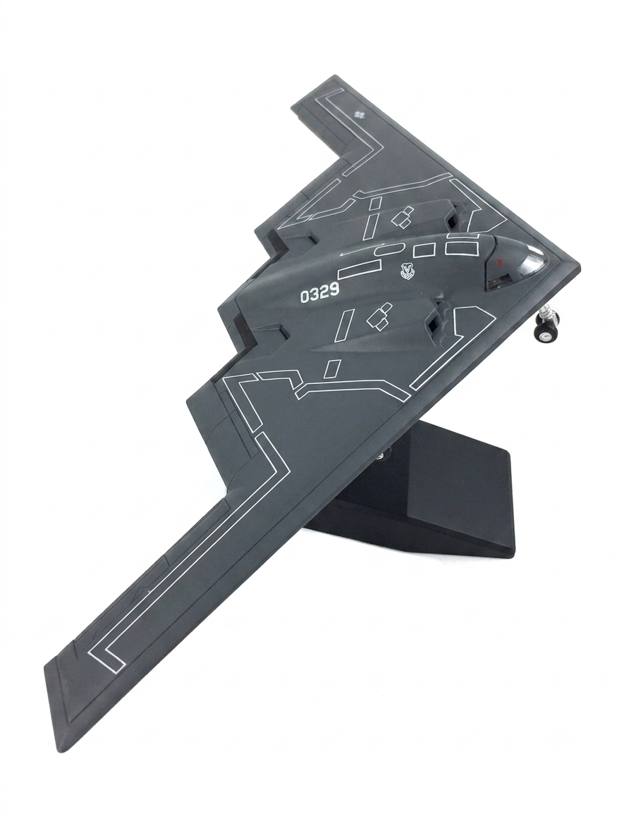 1:200 scale diecast model of the USAF B-2 Spirit Stealth Bomber mounted on a black display stand