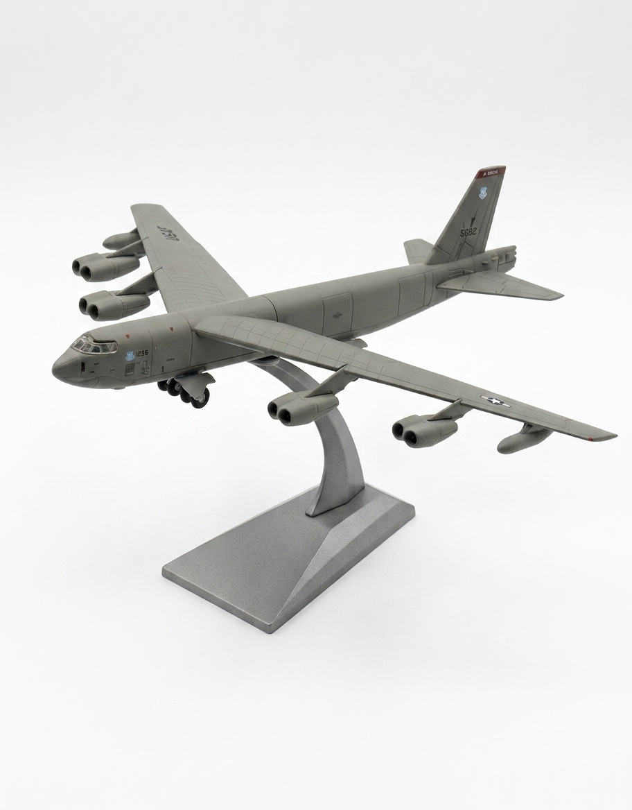 1:200 scale B-52 Stratofortress diecast bomber mounted on metallic display stand, front left flight angle.