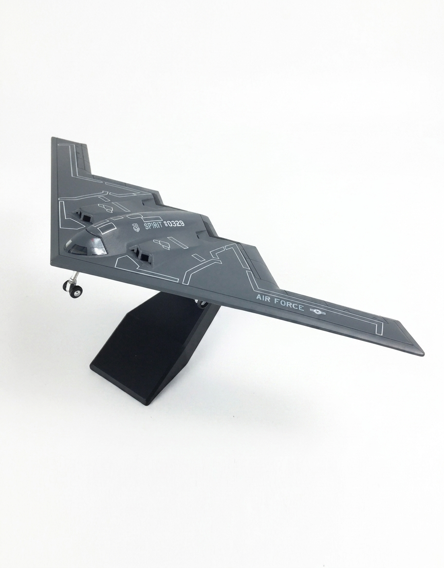 Left side angle of 1:200 scale USAF B-2 Spirit stealth bomber diecast aircraft model on display stand
