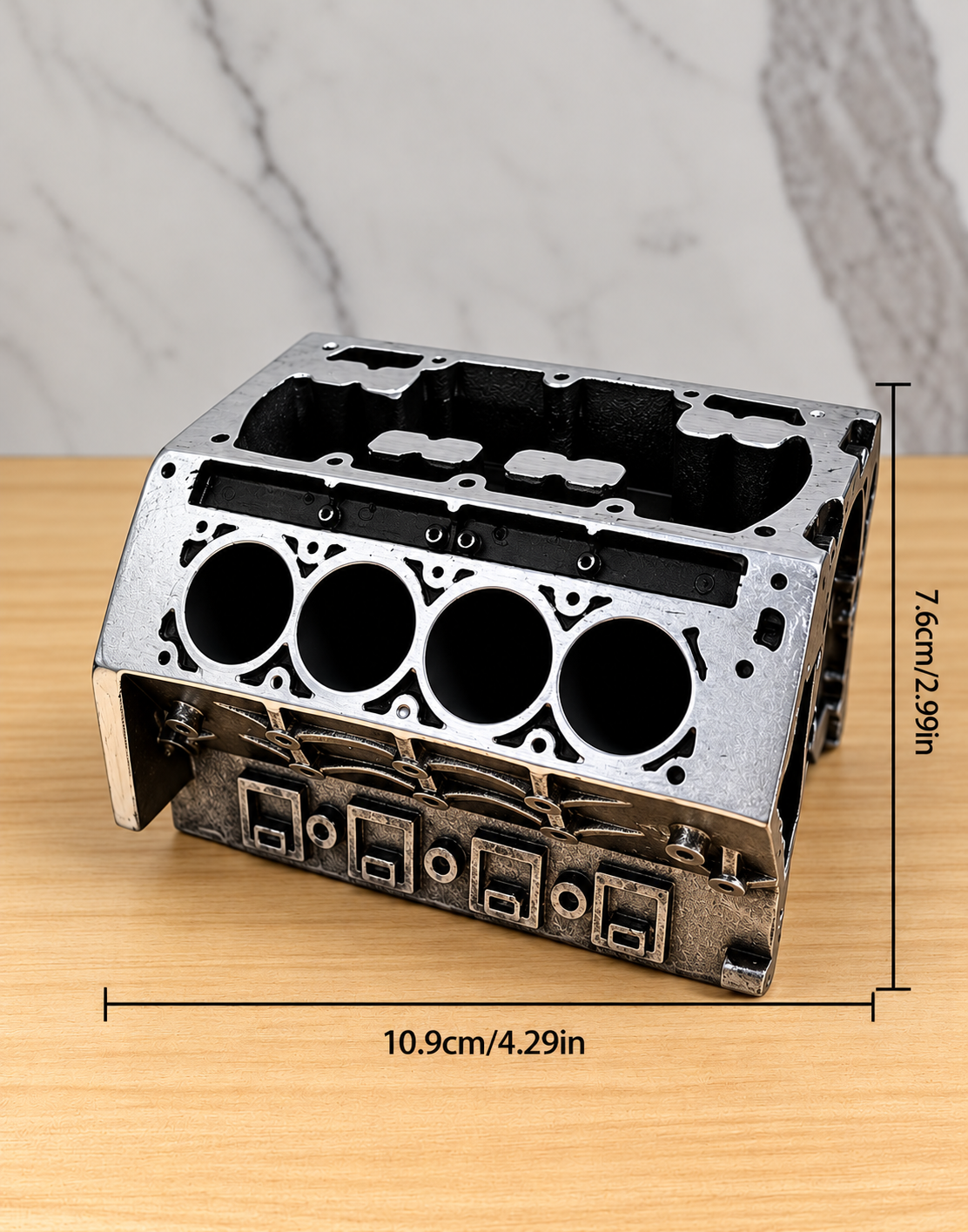 Product dimensions diagram for miniature V8 engine card and pen holder measuring 10.9 cm long by 7.6 cm high for compact office desks.