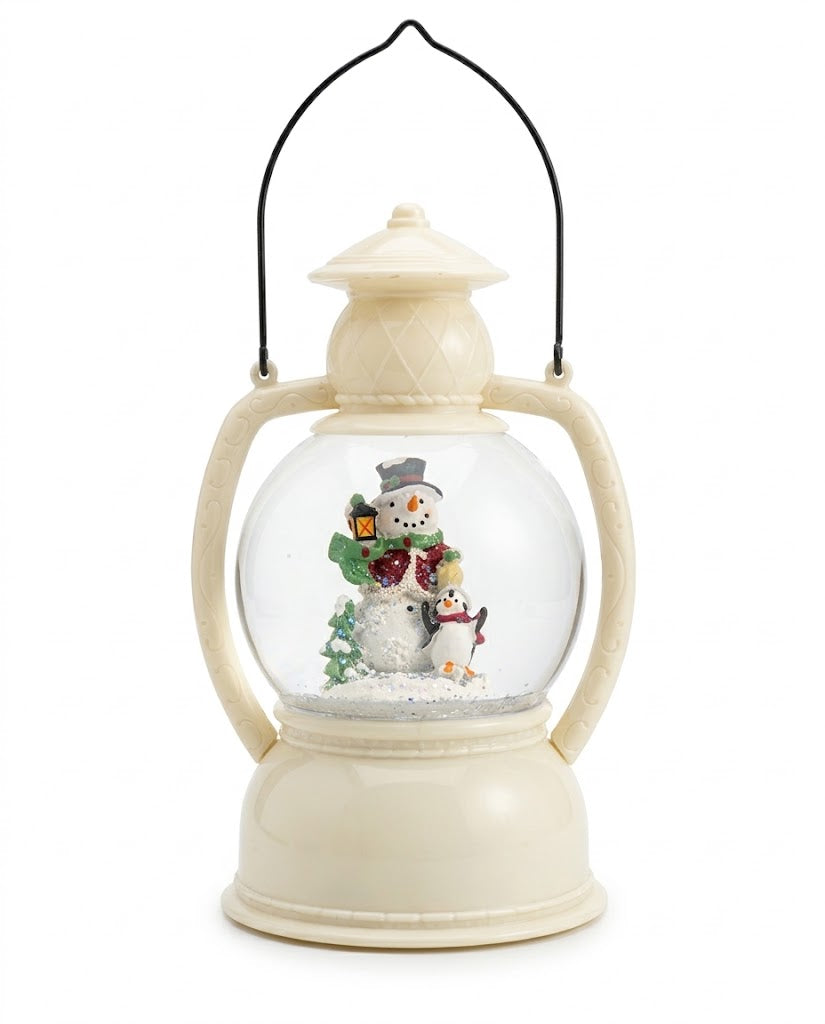 Battery-operated vintage ivory LED Christmas snow globe lantern with snowman and penguin figurines, holiday home decor in Lebanon.