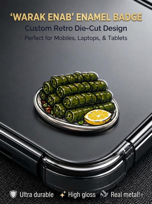 Die-cut Warak Enab stuffed grape leaves enamel metal badge sticker with lemon wedge attached to the back of a phone