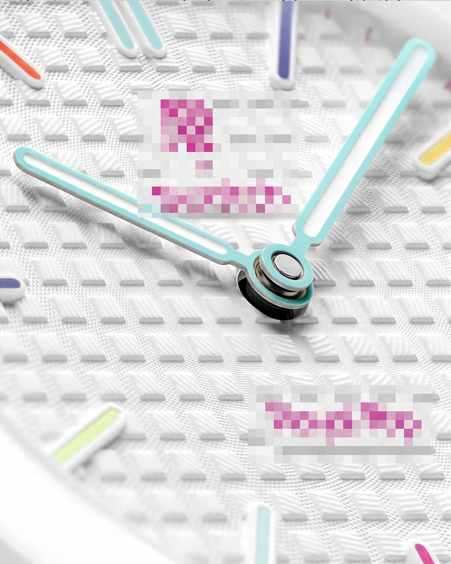 Detailed close-up of white waffle-textured watch dial with light blue hands and multi-colored index markers.