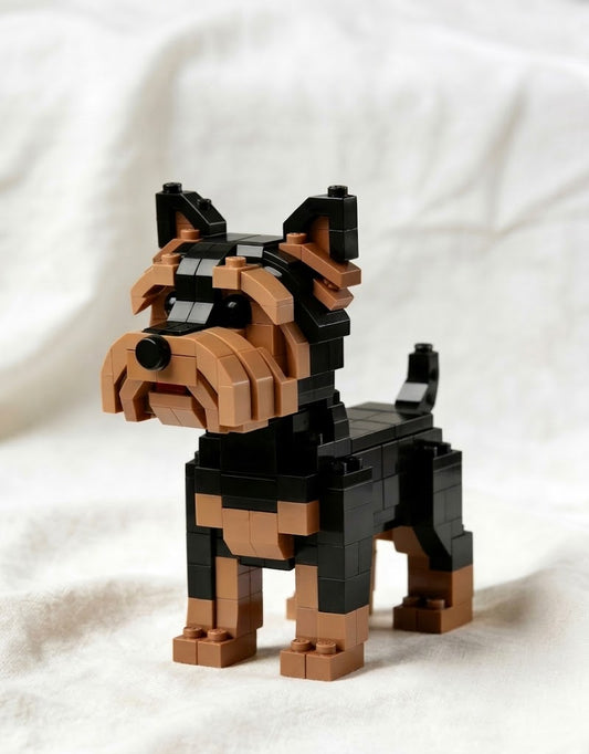 Black and tan Yorkshire Terrier dog model built from interlocking blocks on a clean neutral background.